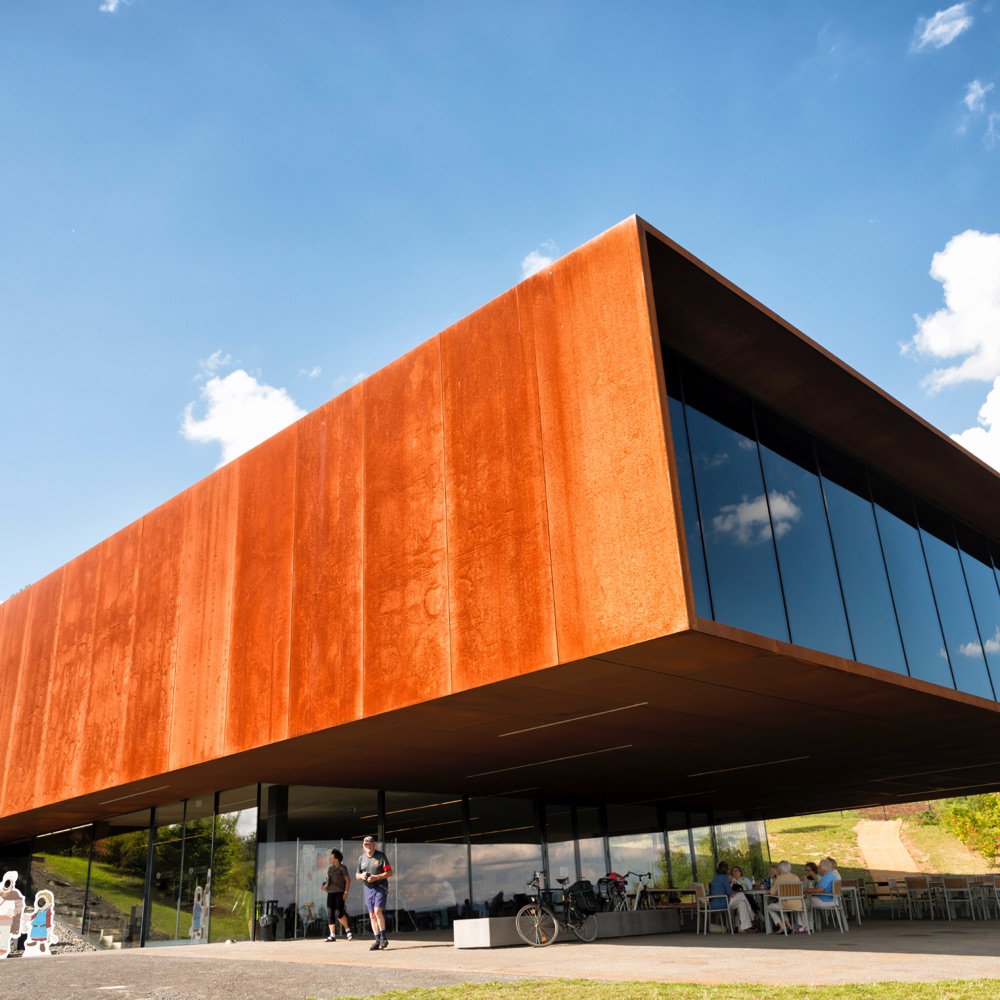 The museum and research center of the Celtic culture. The museum was opened in 2011 by the Hessen office of built heritage conservation ( Landesamt fȕr Denkmalpflege Hessen). It is located at the important place of discovery of a Celtic settlement aged about 5 thousend B.C. In the front of the building you see visitors watching and enjoing at the location.